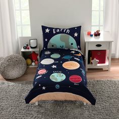 a child's bed with an elephant and space theme