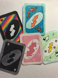 four magnets with different designs on them