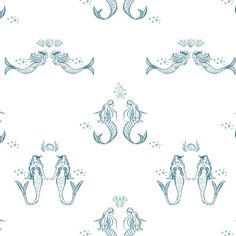 a blue and white pattern with mermaids on it