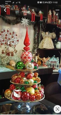 a christmas tree made out of ornaments in a store