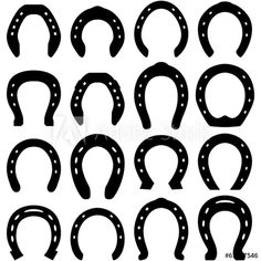 an assortment of black horseshoes on a white background