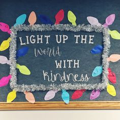 a chalk board with writing on it that says, light up the world with kindness