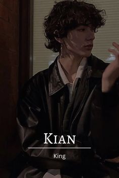 a woman sitting down with her hand up in front of her face and the words kian king on it