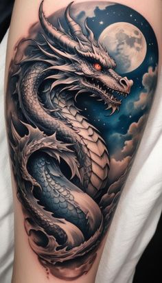 a black and white tattoo with a dragon on it's arm, in front of a full moon