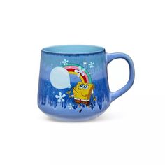 a blue coffee cup with spongebob on it and snowflakes in the background