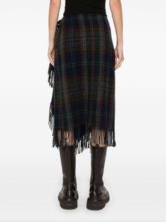 Elevate your wardrobe with the Polo Ralph Lauren fringe-trim plaid wrap skirt. Crafted from premium materials, this skirt boasts a timeless plaid print and stylish fringe trim. Perfect for adding a touch of sophistication and luxury to any outfit. Wrap yourself in elegance with this exclusive piece from Polo Ralph Lauren.Highlightsnavy blue/multicolourwool blendplaid check patternfringed trimwraparound styleside button fasteningside tie fasteningunlinedCompositionWool 68%, Polyamide 26%, Other fibres 6%Washing instructionsDry Clean OnlyBrand style ID: 211941447Colour: 001 Plaid Wrap Skirt, Linen Wrap Skirt, Ralph Lauren Skirts, Patchwork Skirt, Wool Wrap, Fringe Skirt, Suede Skirt, Fringe Trim, Green Skirt