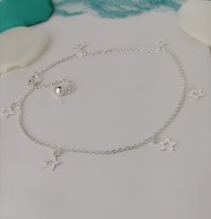 Sterling Silver Star Anklet / Ankle Bracelet This is a very pretty dainty chain which is 9.5 inches that will extend to 10.5 Inches. The perfect Anklet to wear everyday :-) If you are buying this as a gift for someone and want to make it extra special, how about adding one of our Messages in a Bottle...  We have 6 bottle designs to choose from and a  number of different messages and quotes that can be included on your scroll. Please follow the following link for our Messages in a bottle. https://oceansofsilvershop.etsy.com/uk/listing/1168876950/message-in-a-bottle-keepsake Your Message in a bottle will be delivered with your Jewellery. Free Postage and Delivery in the UK and US. All Items are dispatched in 1-2 days with standard Royal Mail. Our Jewellery  is beautifully packaged & includes Star Charm Anklets Suitable As A Gift, Star Charm Anklets For Gifts, Star Charm Anklets As Gift, Messages In A Bottle, Star Anklet, Bottle Designs, Shell Ring, Mail Delivery, Dainty Chain