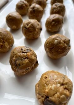 a white plate topped with cookies and muffins