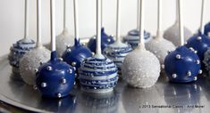 there are many blue and white cake pops