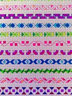 an image of different colored stitchs on white paper with blue, green, pink and purple