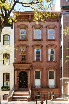 an apartment building with many windows and stairs