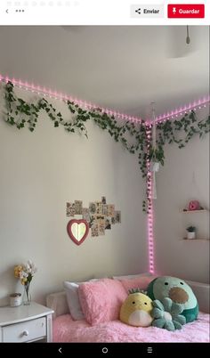 a bed with stuffed animals on it in a room decorated for valentine's day