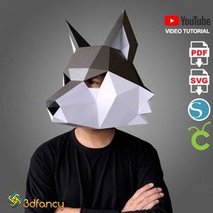 a man wearing a paper mask with an origami fox on it's face