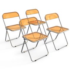 three clear plastic chairs sitting next to each other on a white surface with no one in it