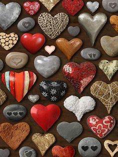 there are many different heart shaped cookies on the table with words happy valentine's day