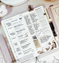 an open planner sitting on top of a table