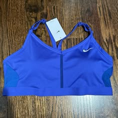 Nike Dri-Fit Indy Sports Bra Size 1x Nwt Color: Lapis Light Impact Soft, Stretthy Fairie With Di-Fir Techology Moves Sweat From Your Skin For Quicker Evaporation To Help You Stay Dry And Comfortable Removable Pads Slip In From The Top So You Can Make Easy Adjustments Mesh Side Panels Shaped Like Swoosh Designs Take Breathable Style To The Next Level. Flat Seams Are Bonded To Create A Smooth Feel That Makes It Comfortable Enough To Wear All Day Mini Nike Logos On The Front Of The Straps Let You M Nike Sports Bra Outfit, Nike Bras, Track Fits, Mini Nike, Track Outfits, Nike Logos, Nike Clothes, Sports Bra Outfit, School Meals