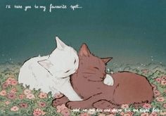 two cats cuddle together in the grass with pink flowers on either side and one cat laying down