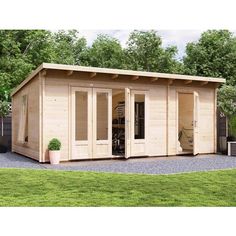 a wooden shed with doors open and windows on the side, sitting in a yard