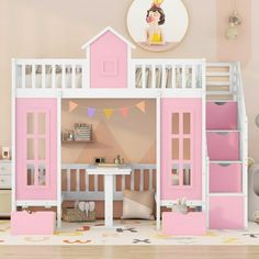 there is a doll house with pink furniture