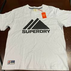 Superdry Mens White Mountain Sport Mono Short Sleeve Pullover T Shirt Size 12 Brand: Superdry Department: Men Size: 12 Color: White Type: T Shirt Style: Pullover Pattern: Solid Theme: Classic Neckline: Crew Neck Occasion: Casual Season: All Season Features: Easy Care, Breathable Sleeve Length: Short Sleeve Condition: New With Tags I Offer Discounts For All Return Customers. - Jvs Superdry Style, Pullover Pattern, Mountain Sports, Superdry Mens, Graphic Tshirt Design, T Shirt Style, White Mountain, Short Sleeve Pullover, Tshirt Design