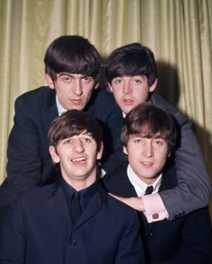 the beatles are posing for a photo together