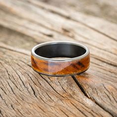 a close up of a ring on a wooden surface