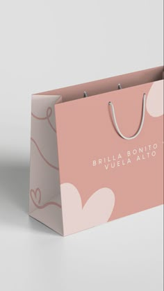 a pink shopping bag with the words bridal bonito written in white on it