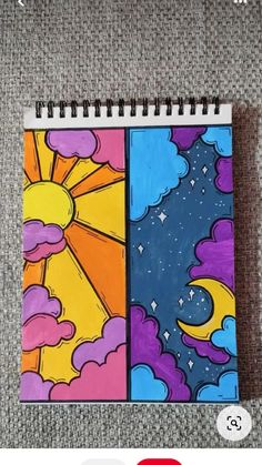 a spiral notebook with an image of the sun and clouds on it, which are colored in different colors