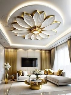 a living room with white couches and gold accents on the ceiling is lit by recessed lights