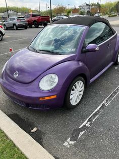 a purple car parked in a parking lot