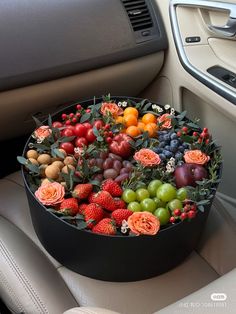 a car dashboard filled with lots of fruit and flowers