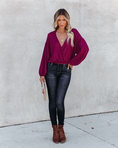 OSHNOW Billowy Fit 62% Polyester. 34% Rayon and 4% Spandex Hand Wash Cold. Dry Flat Made in the U.S.A Draped Neckline Long Sleeves with Elastic Cuffs Elastic Waistband Knit Fabrication No Closures Not Lined //OSHNOW// Draped tops are so flirty for a night out! Our Awaken Autumn Knit Drape Top comes in berry. Designed with a billowy fit and long sleeves. Pair this sultry top with faux leather pants! Styled with the Multicolor Amal Drop Gem Earrings. 5 Disc Choker. The Buddha Wheel Necklace. Minimal Herringbone Necklace. Simple Bangle Bracelet. Stella Crossbody Envelope Zip Clutch. Daily High Rise Skinny. and Jocelyn Heeled Bootie.---SIZE AND FIT---Model is Wearing a Size Small. Height is 5'7". Bust is 32". Waist 25". and Hips 30" Size XS: Length measures 19.5" from shoulder to hem with a 40 Draped Tops, Drape Top, Simple Bangle, Draped Neckline, Gem Earrings, Draped Top, Distressed Denim Jacket, Cropped Denim Jacket, Faux Leather Pants