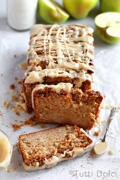 sliced loaf of apple bread with icing on top