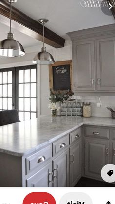 a large kitchen with gray cabinets and white counter tops is featured in an orange postcard