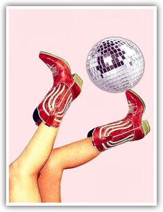 a woman's legs with red high heels and disco ball