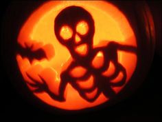 a carved pumpkin with an image of a skeleton on it's face in front of a full moon