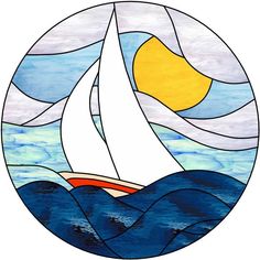 a stained glass window with a sailboat in the ocean