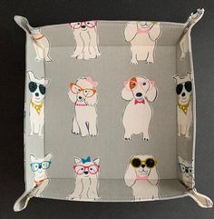 a tray with dogs and sunglasses on it