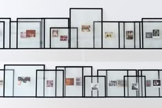 multiple frames are arranged on the wall to display photographs