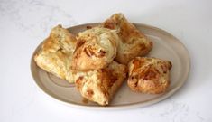 several pastries on a plate with white background