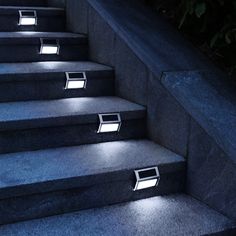 some steps with lights on them in the dark