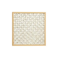 a wooden frame with an intricate pattern on it