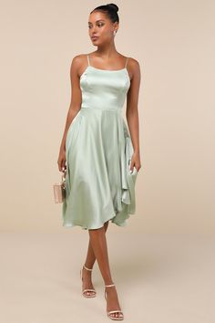 We hope every day can feel like the ones we spend in the Lulus Days Like Today Sage Satin Asymmetrical Tie-Back Midi Dress! Textured woven satin creates a princess-seamed bodice with an apron neckline and a tying back cutout, supported by adjustable spaghetti straps. High waist tops a flowy midi skirt with an asymmetrical hem. Fit: This garment fits true to size. Length: Mid-calf length. Size medium measures 40.5" from adjustable straps to hem. Bust: Great for any cup size. Waist: Fitted - very Midi Dress Satin, Flowy Midi Skirt, Midi Dress Green, Asymmetrical Midi Dress, Semi Formal Dress, Dress Satin, Satin Midi Dress, Asymmetrical Skirt, Green Midi Dress