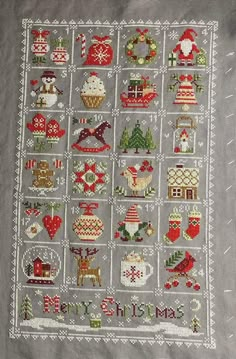 a cross stitched christmas pattern on a gray background