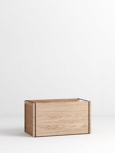 a wooden box sitting on top of a white surface