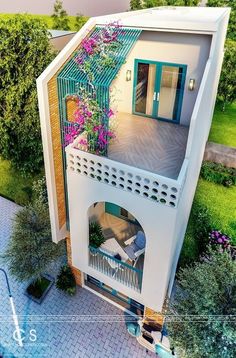 an aerial view of a house with flowers on the balcony