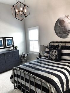 a bed room with a black and white bedspread