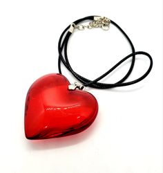 "Blood Red Glass Heart Necklace. A gorgeous puff heart shaped pendant in beautiful blood red. A real eyecatcher! It is a statement necklace and measures approximately 4.5cms wide at it's widest point. A real beauty! Comes to you on a necklace which is 16\" leather cord with a 2\" extender chain. It is presented in gift packaging." Jasper Core, Red Glass Heart Necklace, Puffed Heart Necklace, Glass Heart Necklace, Heart Shaped Pendant, Edgy Makeup, Red A, Puffed Heart, Virtual Stylist