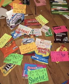 many candy bars have been left on the floor for someone to write their names and pictures